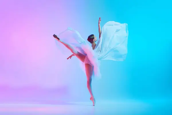 Graceful Ballerina Tutu Dancing Standing Tiptoe Fabric Flowing Motion Neon — стоковое фото