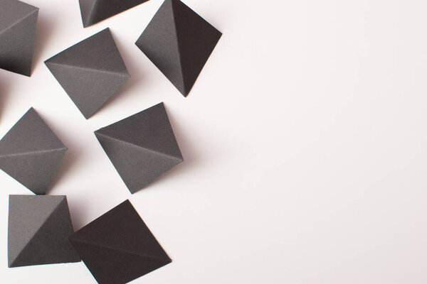 Black triangle shapes on white background with copy space