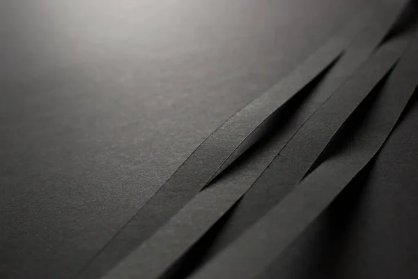 Black 3d stripes on black paper background