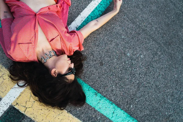 Young Model Posing Fashion Photoshoot Wearing Latex Pants Lying Floor — Stock Photo, Image