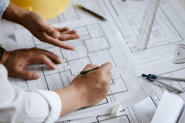 Team engineer or architect meeting for project working with partner and engineering tools on model building and blueprint in working site. Construction concept