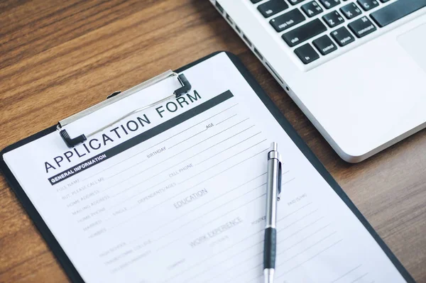 application form and pen on the table 
