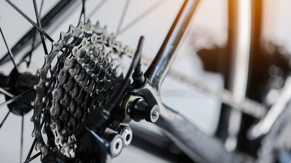 Closeup of a bicycle gears mechanism and chain on the rear wheel