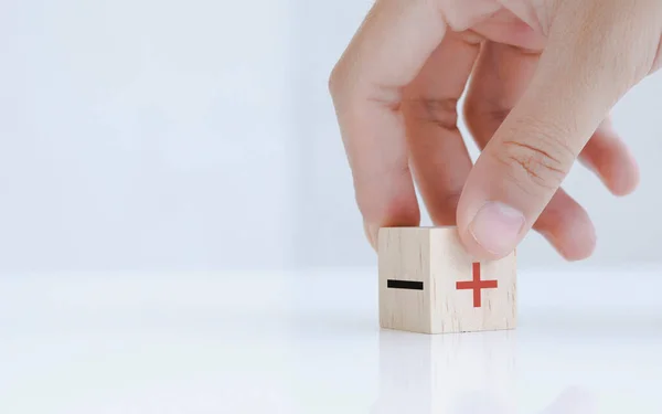 Hand Chooses Negative Positive Icon Wood Cube Changing Point View — Fotografia de Stock