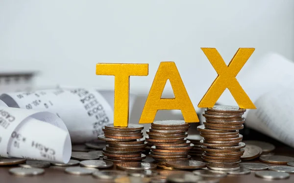 Tax Concept Word Tax Put Stacked Coins Bills Wooden Table — Fotografia de Stock