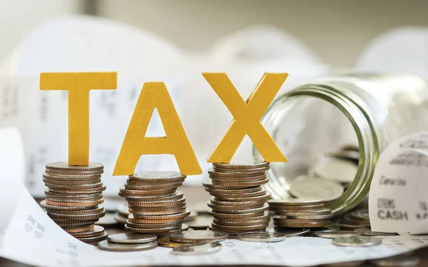 Tax Concept Word Tax Put Stacked Coins Glass Bottles Bills — Fotografia de Stock