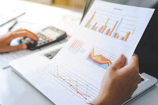 woman accountant doing finance and calculate on a desk about cost at the home office. finance accounting concept