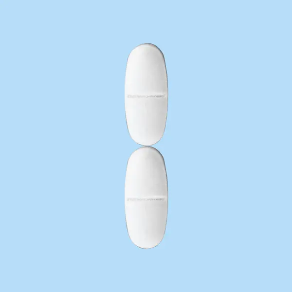 Písmeno Vyloženo Pilulkami Modrém Pozadí — Stock fotografie