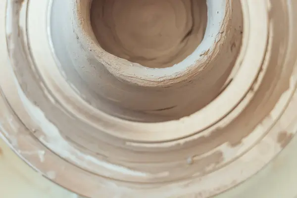 stock image ceramics class, a man makes a clay plate on a potter's wheel