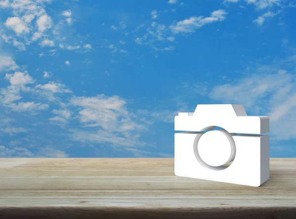 Camera 3d icon on wooden table over blue sky with white clouds, Business camera service shop concept