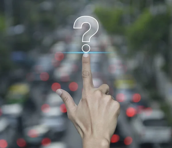 Hand pressing question mark sign flat icon over blur of rush hour with cars and road in city, Business customer service and support concept