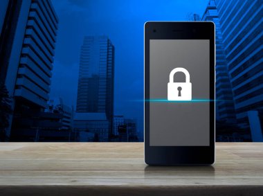 Key flat icon on modern smart mobile phone screen on wooden table over office city tower and skyscraper, Technology security online concept