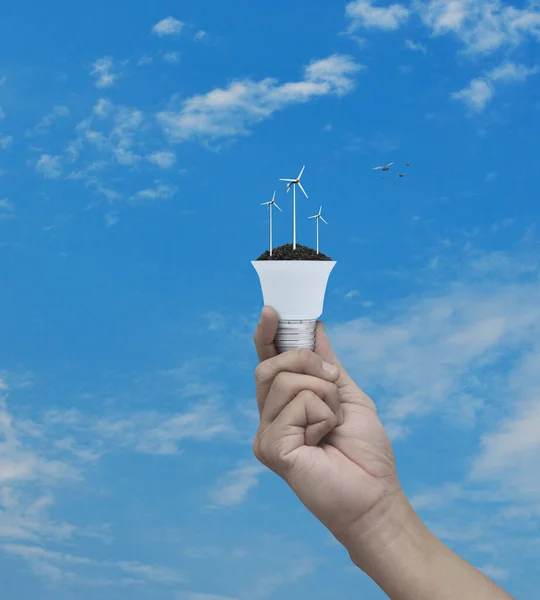 Hand Holding Wind Turbines Soil Light Bulb Blue Sky Birds — Stock Photo, Image