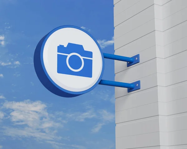 Icono Cámara Colgar Letrero Redondeado Azul Sobre Cielo Concepto Servicio —  Fotos de Stock