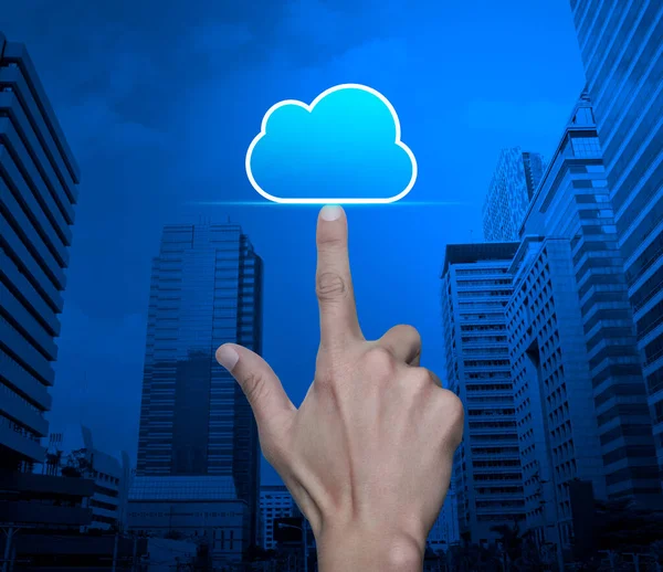 Hand click on cloud computing icon with copy space over modern city tower and skyscraper, Technology cloud computing concept