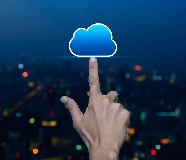 Hand click on cloud computing icon with copy space over blur colorful night light modern city tower and skyscraper, Technology cloud computing concept