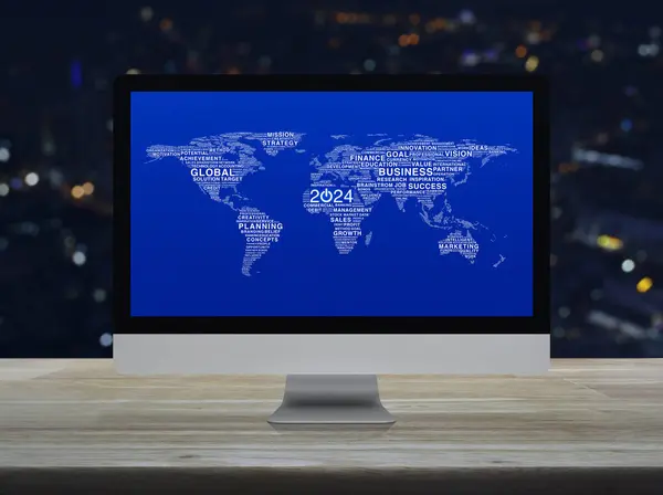 Start up business icon with words world map on computer screen on table over blur colorful night light city tower, Happy new year 2024 global business start up online concept, Elements of this image furnished by NASA