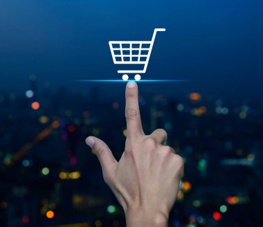 El arabası düz simgesi bulanık gece ışığı modern şehir kulesi ve gökdelen üzerinde iş alışverişi online konsepti