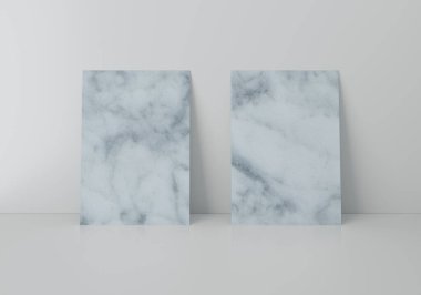 Gri duvarın üzerinde iki mermer desenli dikdörtgen A4 kağıt maketi, 3D görüntüleme.