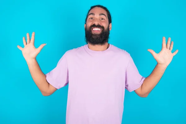 Delighted Positive Caucasian Man Beard Wearing Violet Shirt Blue Background — Stock Photo, Image