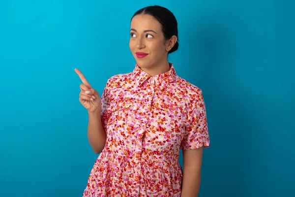 Woman Wearing Floral Dress Points Copy Space Advertises Something Advices — Stock Photo, Image