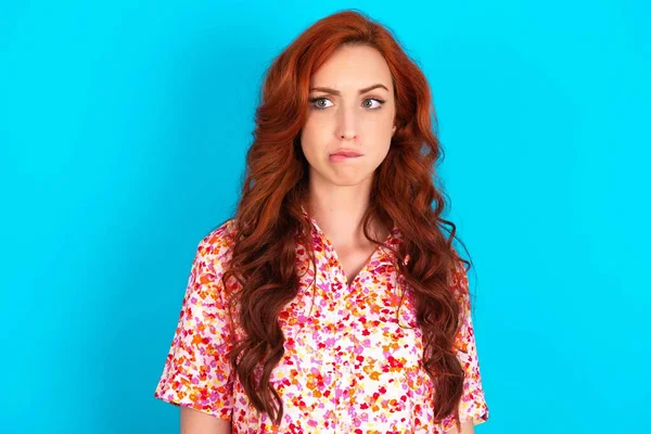 Redhead Woman Wearing Floral Dress Blue Background Being Nervous Scared — Stock Photo, Image