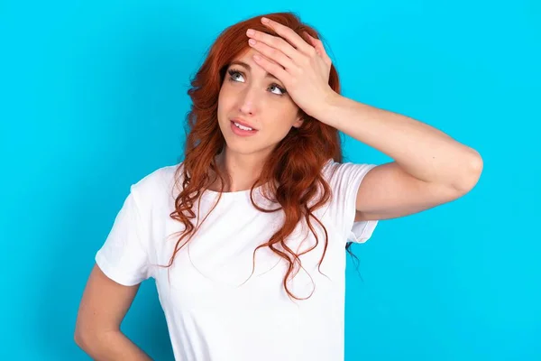 Redhead Woman Wearing White Shirt Blue Background Touching Forehead Hears — Stock Photo, Image