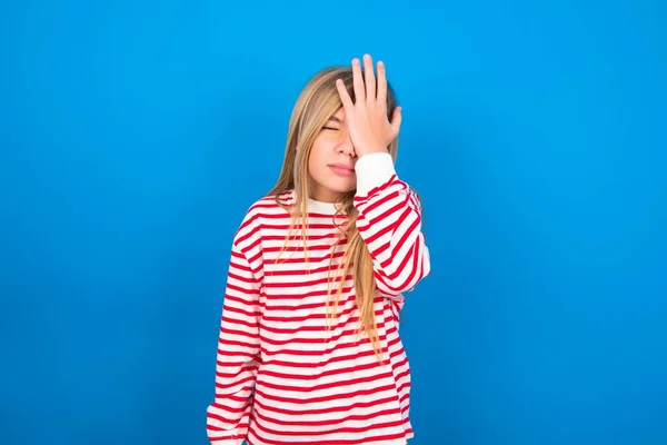 Frustrated Teen Girl Wearing Striped Shirt Blue Background Holding Hand — Stock Photo, Image