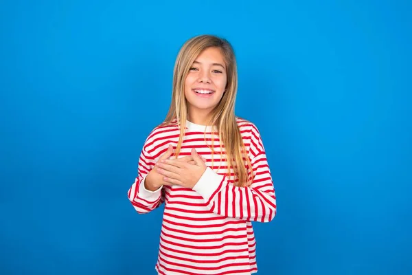 Honest Teen Girl Wearing Striped Shirt Blue Background Keeps Hands — Stock Photo, Image