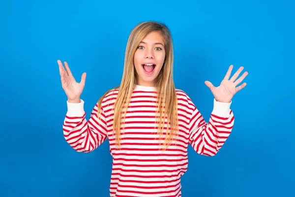 Joyful Excited Lucky Teen Girl Wearing Striped Shirt Blue Background — Stock Photo, Image