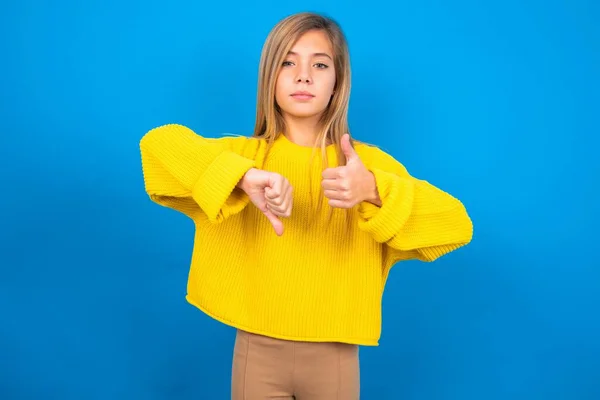 Beautiful Caucasian Teen Girl Wearing Yellow Sweater Blue Studio Background — Stock Photo, Image