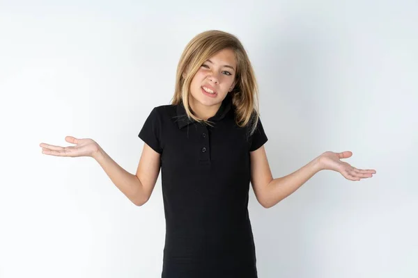 Clueless Beautiful Caucasian Teen Girl Wearing Black Shirt White Wall — Stock Photo, Image