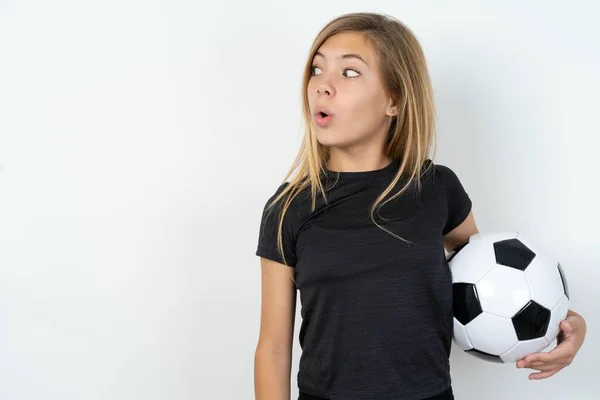 Shocked Teen Girl Wearing Sportswear Holding Football Ball White Wall — Photo