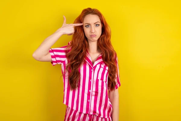 Unhappy Red Haired Woman Makes Suicide Gesture Imitates Gun Hand — Stock Photo, Image