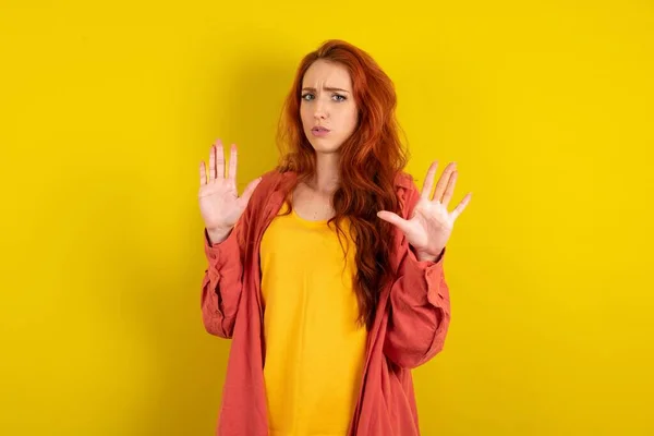 Beautiful Red Haired Woman Standing Yellow Studio Background Moving Away — Stock Photo, Image