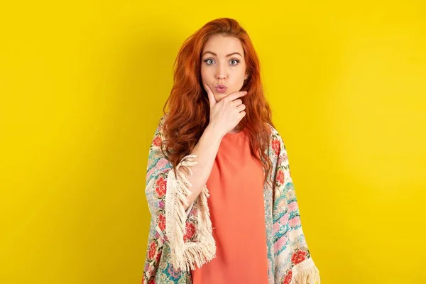 Red Haired Woman Standing Yellow Studio Background Looking Fascinated Disbelief — Stock Photo, Image