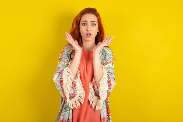 Surprised terrified woman Gestures with uncertainty, stares at camera, puzzled as doesn't know answer on tricky question, People, body language, emotions concept