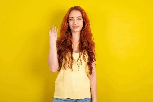Beautiful Red Haired Woman Wearing Yellow Shirt Yellow Studio Background — Stock Photo, Image