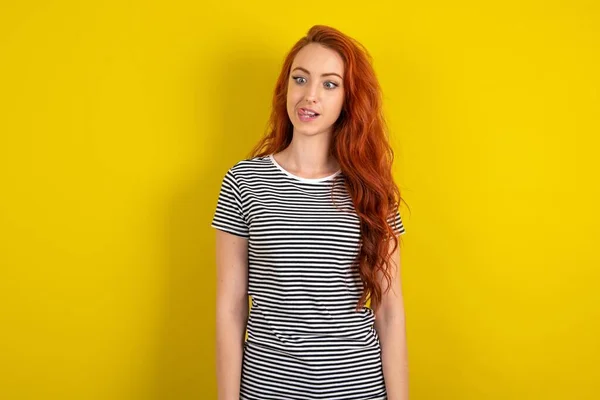 Funny Red Haired Woman Wearing Striped Shirt Yellow Studio Background — Stock Photo, Image