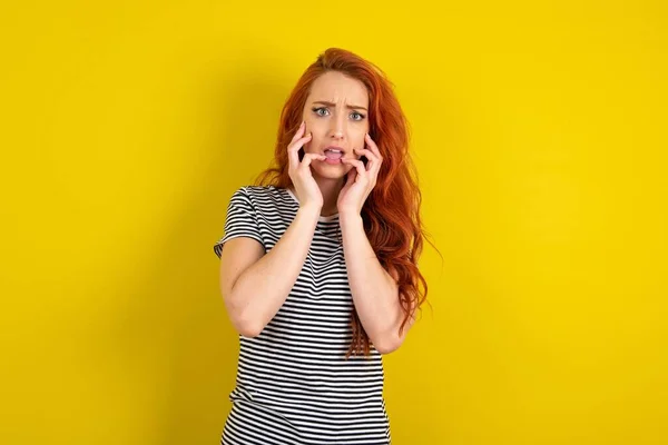 Speechless Red Haired Woman Wearing Striped Shirt Yellow Studio Background — Stock Photo, Image