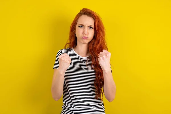 Displeased Annoyed Red Haired Woman Wearing Striped Shirt Yellow Studio — стоковое фото