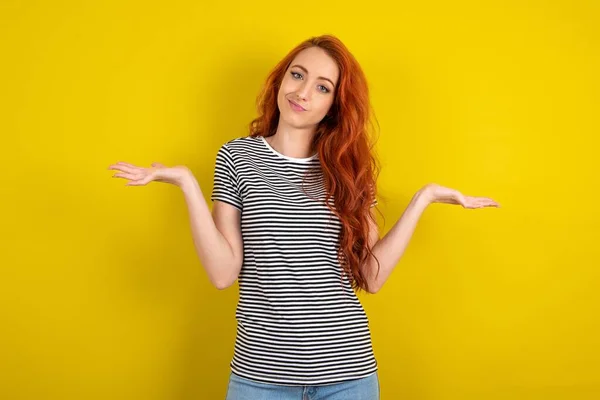Careless Attractive Red Haired Woman Wearing Striped Shirt Yellow Studio — Stock Photo, Image