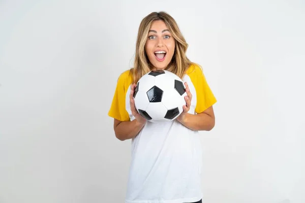 Delighted Positive Young Beautiful Woman Holding Football Ball White Background — Stock Photo, Image