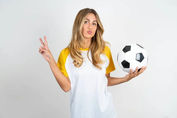 Beautiful Woman Wearing Football Shirt White Background Makes Peace Gesture — Stock Photo, Image