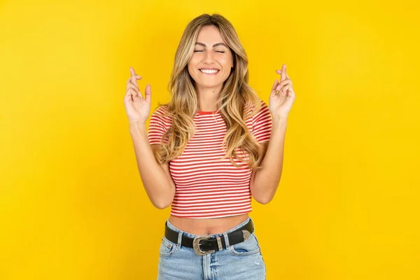 Young Beautiful Blonde Woman Wearing Striped Shirt Yellow Studio Background — Stock Photo, Image