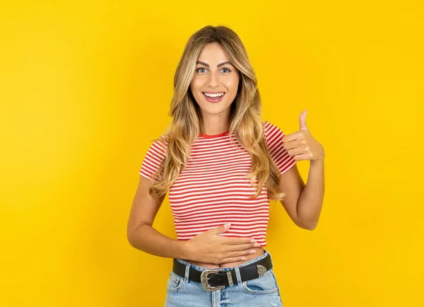 Beautiful Blonde Young Woman Wearing Striped Shirt Yellow Studio Background — Stock Photo, Image