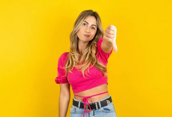 Young Blonde Woman Wearing Pink Crop Top Yellow Background Feeling — Stock Photo, Image