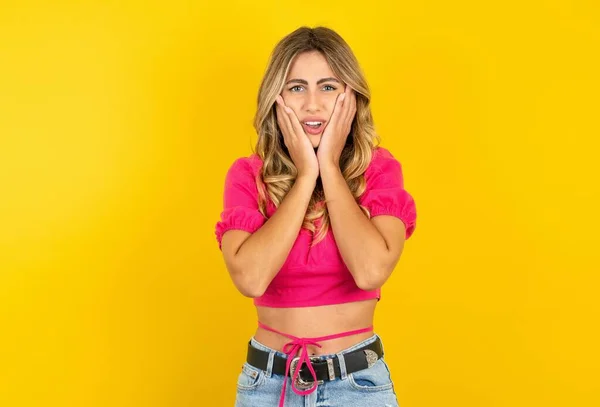 Doleful Blonde Young Woman Wearing Pink Crop Top Yellow Background — Stock Photo, Image
