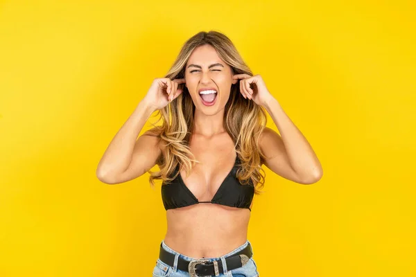 Happy Young Blonde Woman Wearing Bikini Yellow Background Ignores Loud — Stock Photo, Image