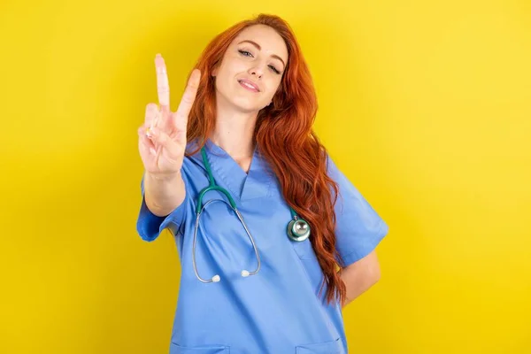 Young Red Haired Doctor Woman Directs Fingers Camera Selects Someone — Stock Photo, Image